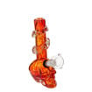 Skull-shaped soft glass bong with winding glass decor on the neck piece. Red body