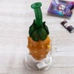 Pineapple bong with orange body, green leaves and neck.