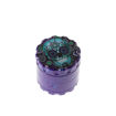 large metal purple herb grinder with blue skull